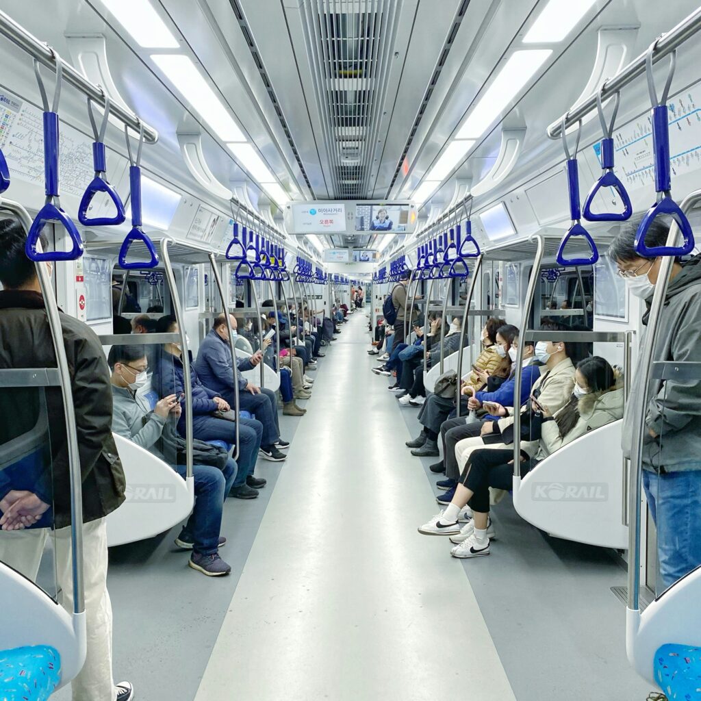 The inside of a busy subway carriage in Seoul, South Korea.
