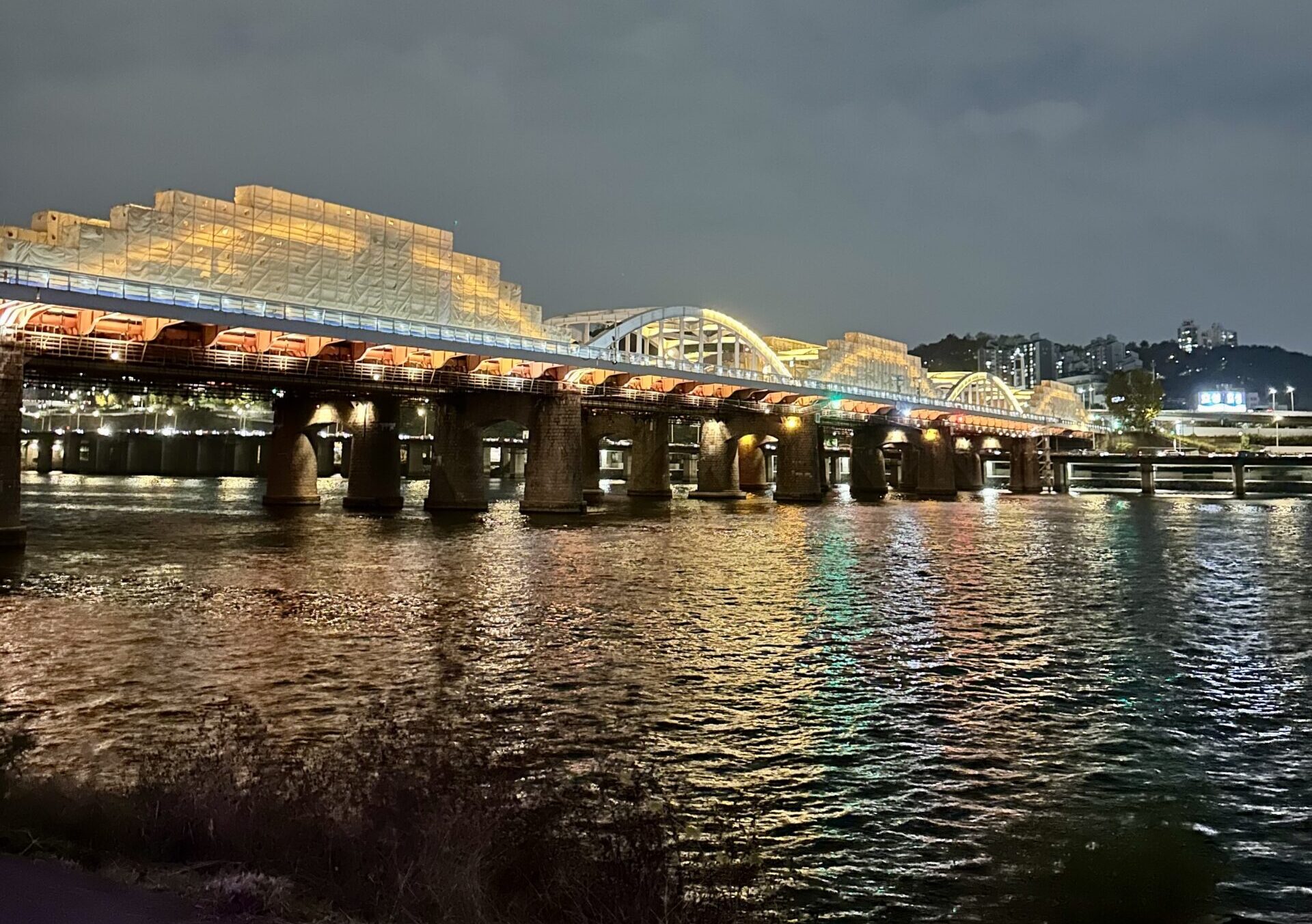 View of the Han River at night from Nodeul Island in Seoul, South Korea.