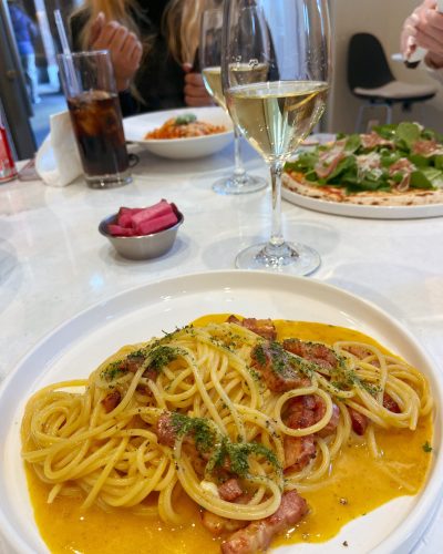Carbonara Pasta with a glass of white wine at Bistro 74 in Myeongdong, Seoul