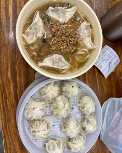 Bowl of kalguksu noodles with mandu dumplings at Myeongdong Kyoja restaurant